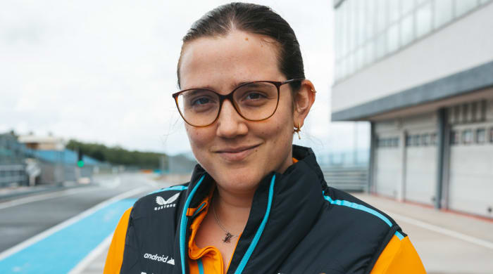 McLaren Racing engineer Amelia Lewis poses outside the F1 team’s garage.